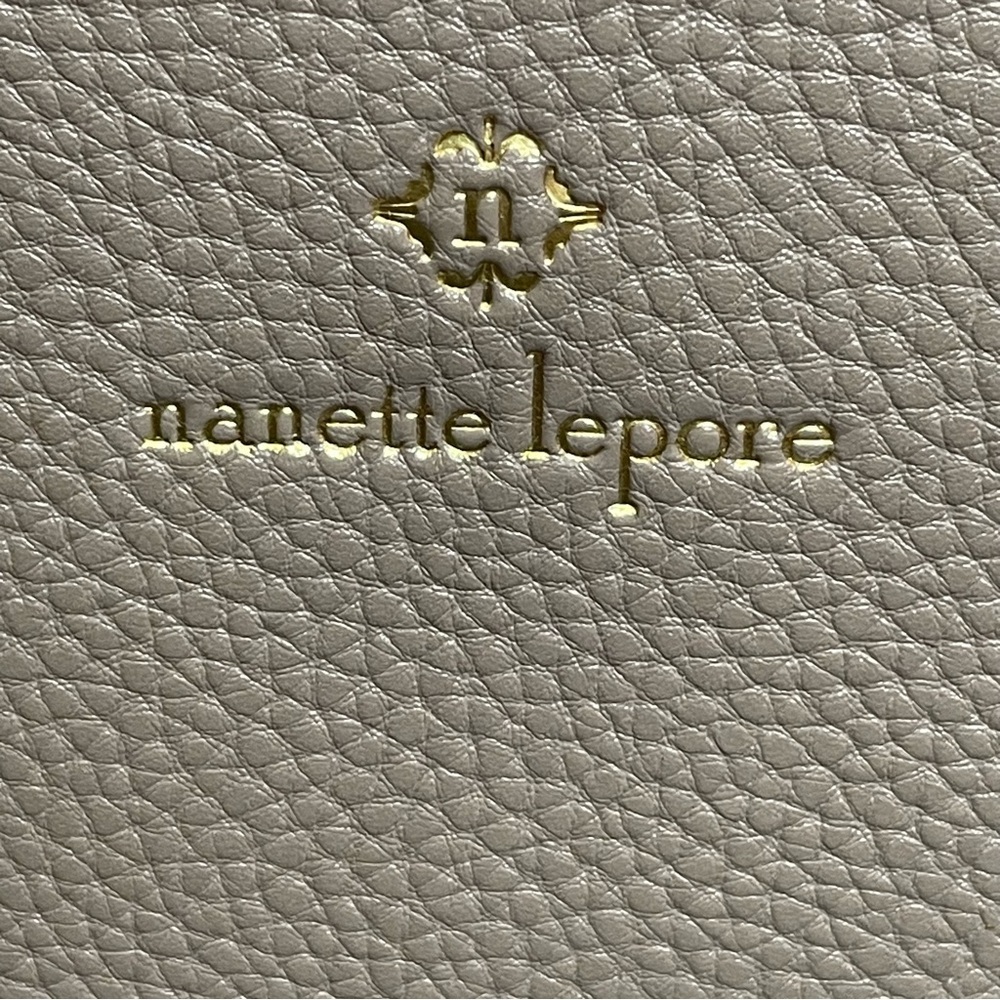 Nanette lepore Tan Clutch with Tassel Accent wristlet. Small flaw on corner - Picture 2 of 9